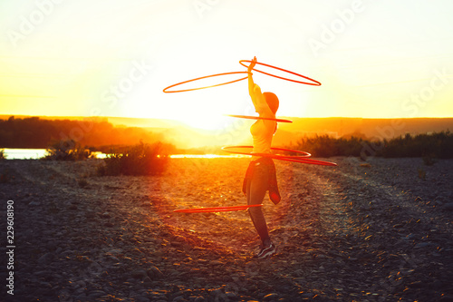 girl with hoops in nature photo