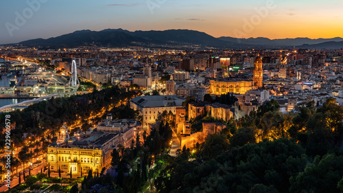 Aerial panoramic view of Malaga city, Andalusia, Spain after beautiful sunset