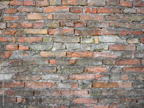 Old dirty weathered brick wall background