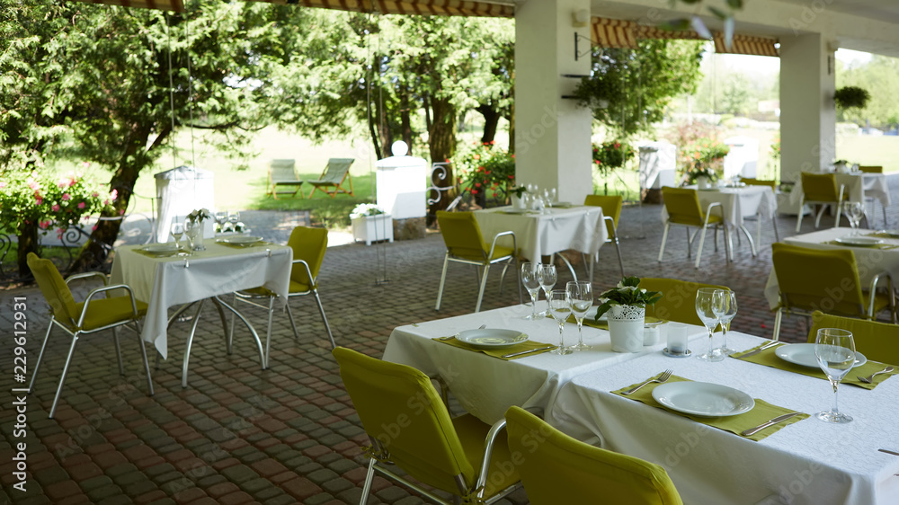 terrace summer cafe with tables and chairs for people, an empty institution for recreation, nobody terrace summer cafe with tables and chairs for people, an empty institution for recreation, nobody