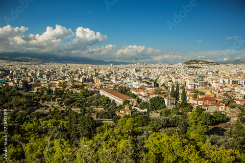 Scenery landscape of Athens - capital of Greece with view on mountain, houses and horizon line with blue sky with clouds from top of hill © Артём Князь