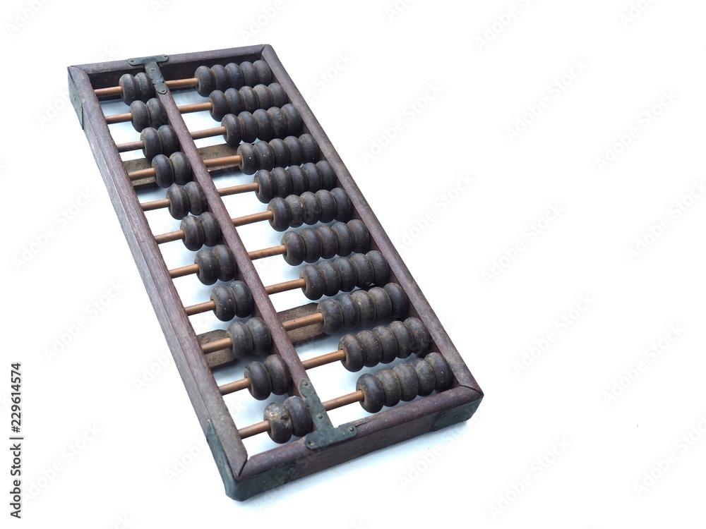 Old and ancient abacus made of wood and attached with a metal plate. On a white background It is a tool for calculating. This is China's first calculator. Old and ancient abacus made of wood and attached with a metal plate. On a white background It is a tool for calculating. This is China's first calculator.