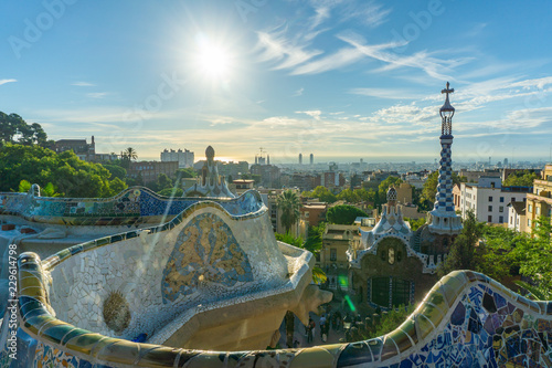 City view with a clear blue sky from the top of Park Guell in Barcelona. Park Guell is one of the famous architect Antoni Gaudi's major works. It is among the most popular tourist attractions.