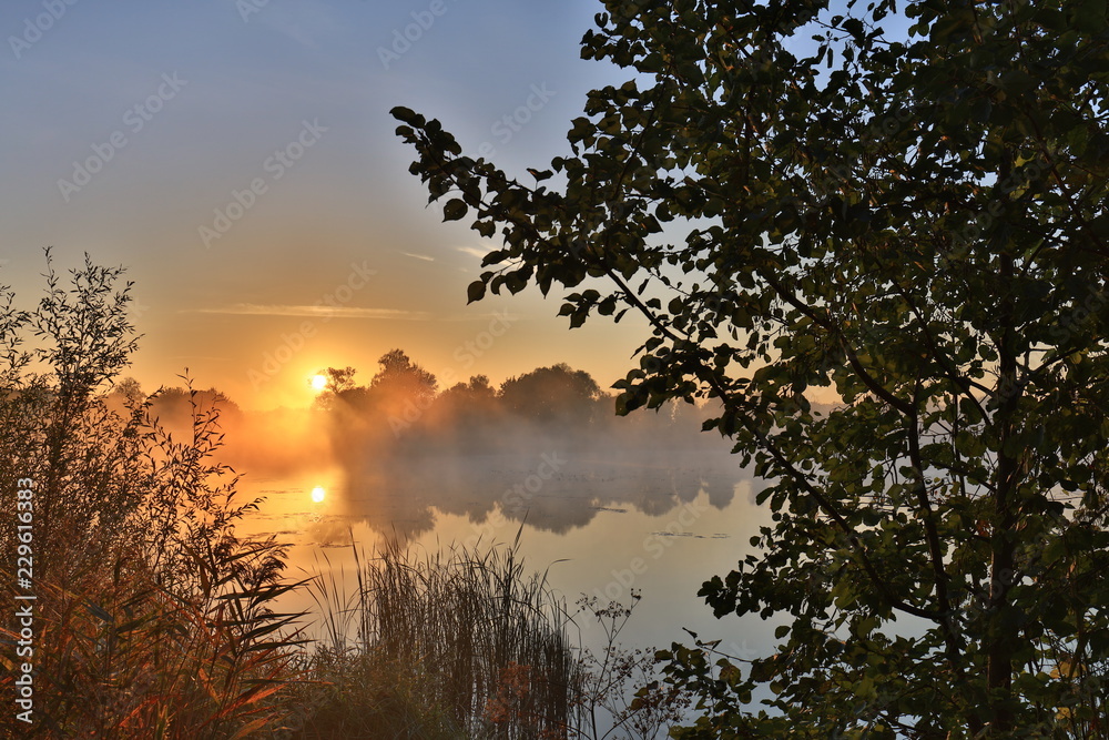 Obraz premium Early morning, sunrise over the lake. Rural landscape. HDR