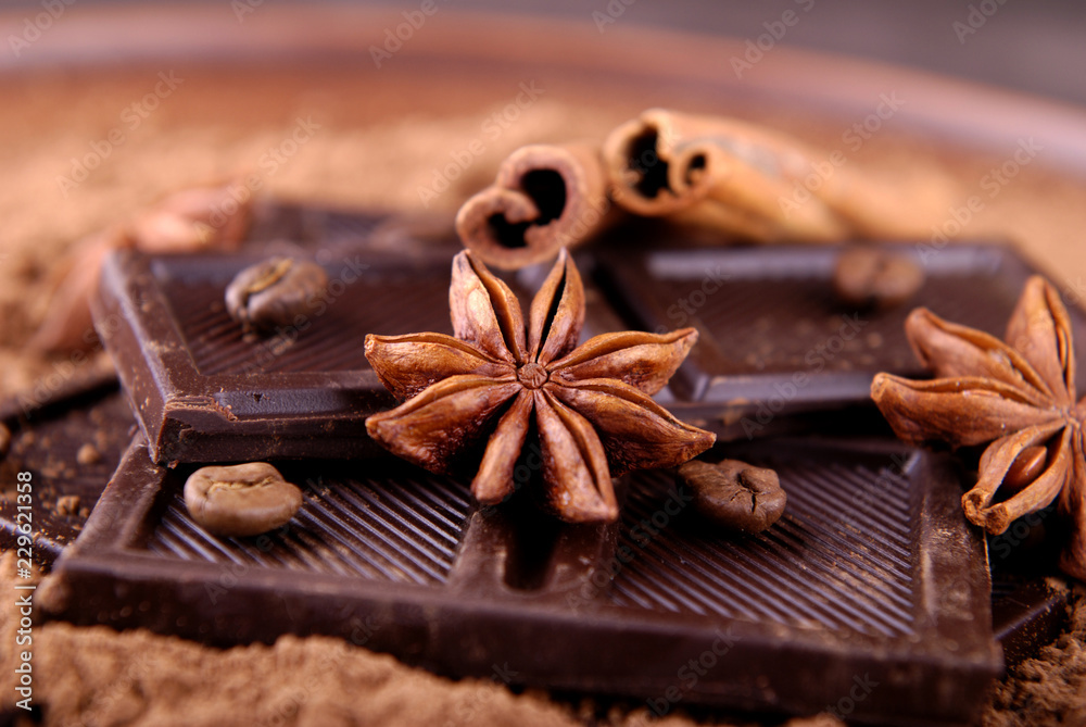 Star anise, dark chocolate and cinnamon sticks. Star anise, dark chocolate and cinnamon sticks.