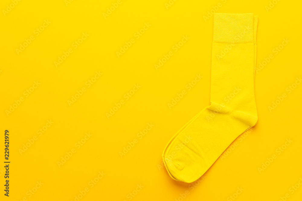 pair of socks on bright yellow background. top view of yellow socks with copy space pair of socks on bright yellow background. top view of yellow socks with copy space
