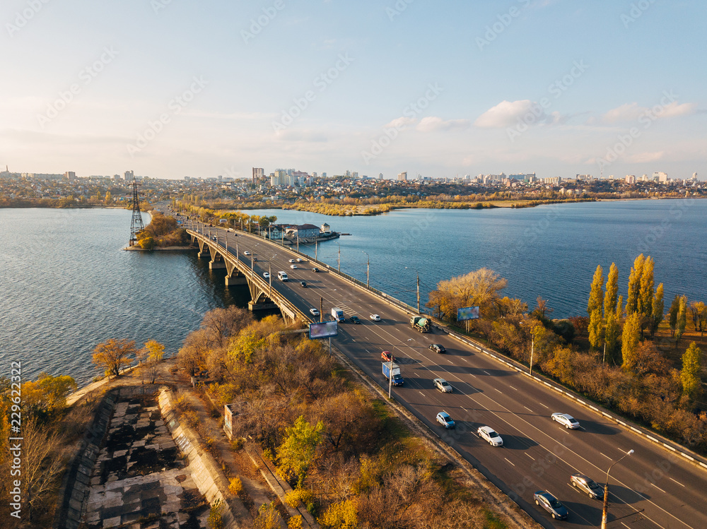 Aerial autumn Voronezh cityscape from drone flight height. View of the bridge over Voronezh Water Reservoir Aerial autumn Voronezh cityscape from drone flight height. View of the bridge over Voronezh Water Reservoir