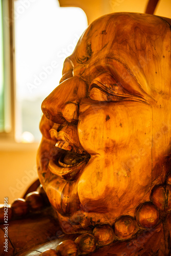 Phra sangkatchai monk statue made from wood in Hyuaplakang temple photo