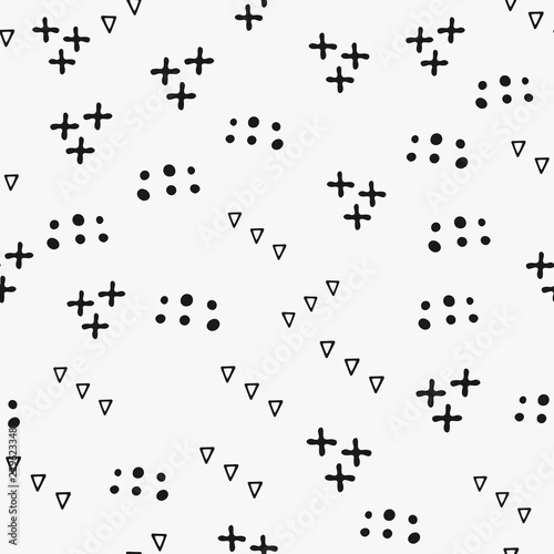 Repeating geometric shapes drawn by hand. Simple seamless pattern with crosses  triangles and round spots. Sketch  doodle.