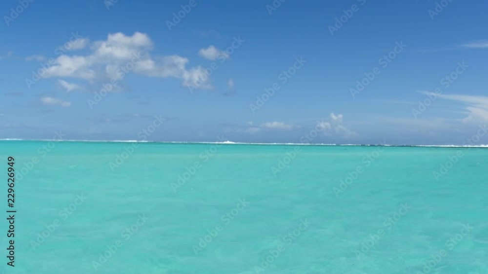 Blue lagoon view in French Polynesia from a boat. Sunny day crystal clear water Blue lagoon view in French Polynesia from a boat. Sunny day crystal clear water