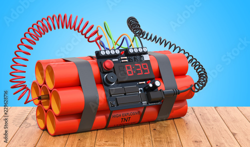 TNT bomb explosive with digital countdown timer clock on the wooden table. 3D rendering photo