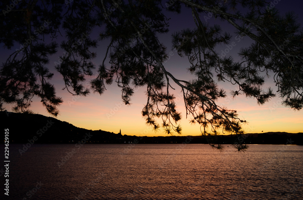 Sunset on Annecy city and toboggan slides on lake, Savoy, France