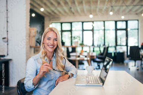 Photography Portrait of a successful female entrepreneur in modern office.
