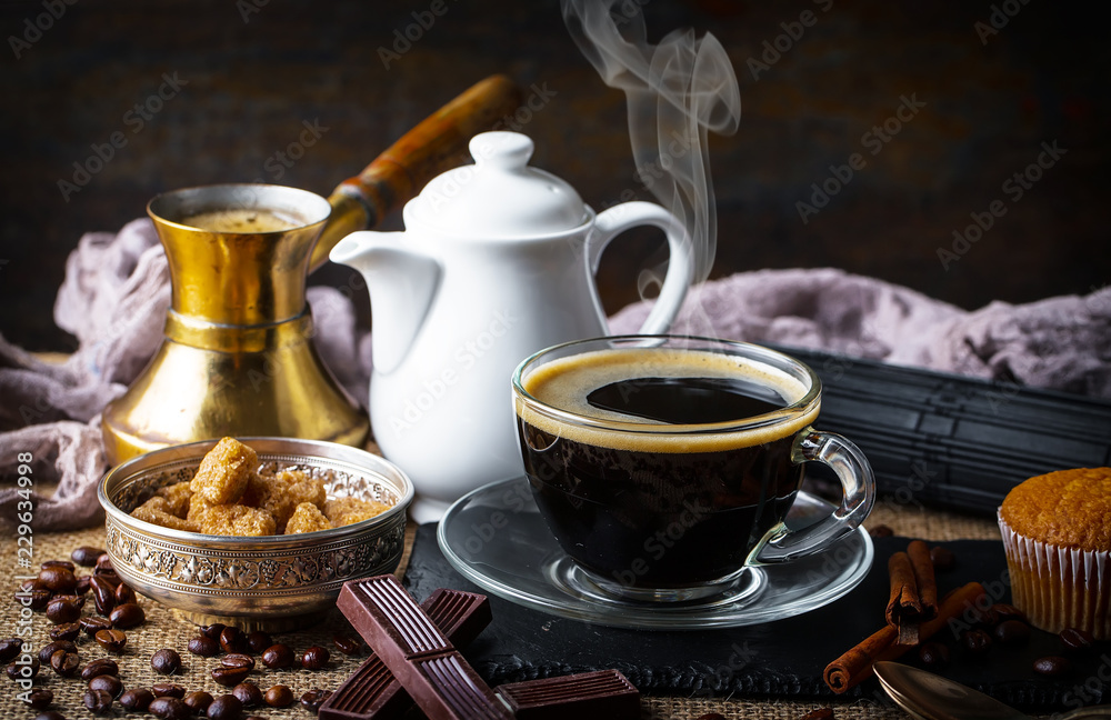 Fototapeta premium Black coffee in a composition with kitchen accessories