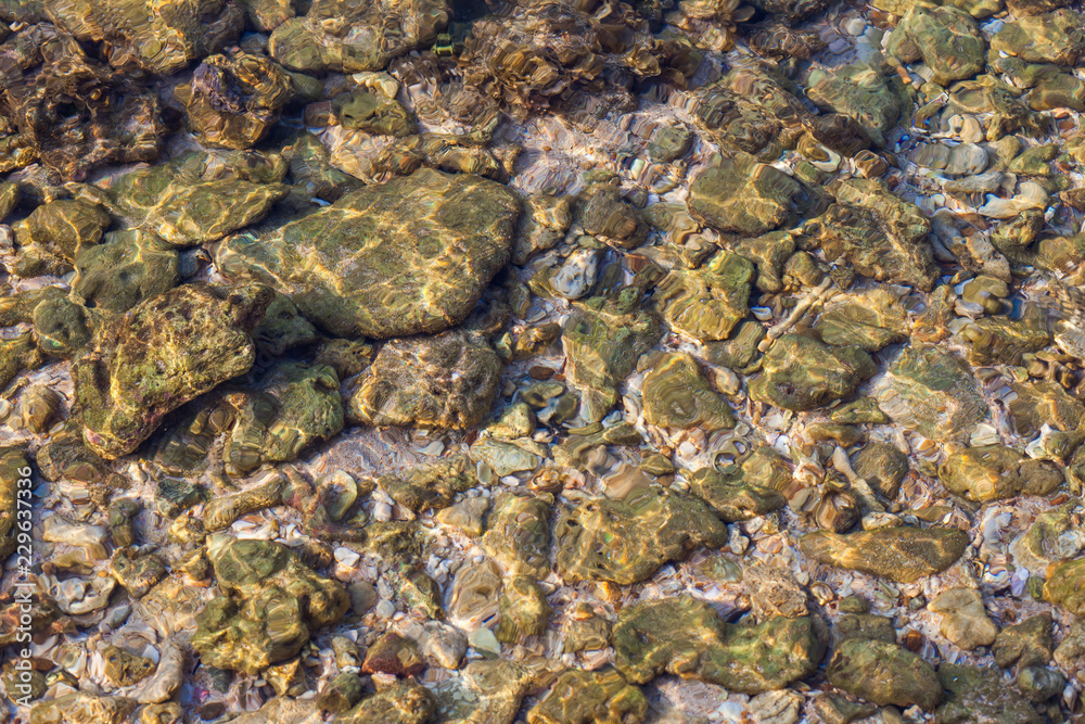 sea stones under water background texture