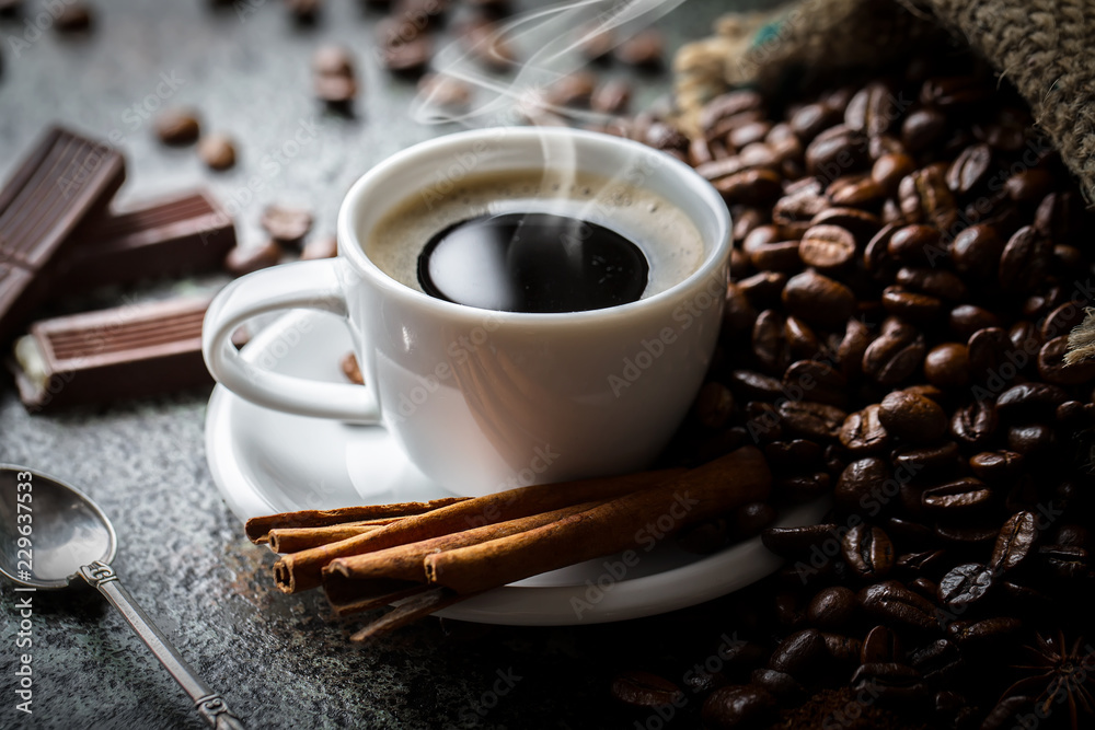 Black coffee in a cup on old background Black coffee in a cup on old background