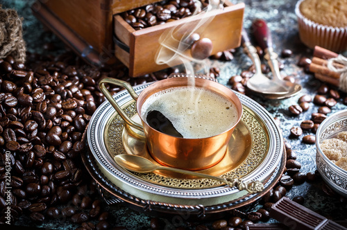 Black coffee on old background © Karnav