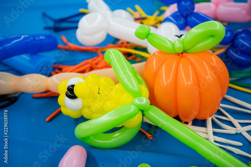 Fototapeta Naklejka Na Ścianę i Meble -  Balloon twisting art children workshop colorful still. Vegetables.