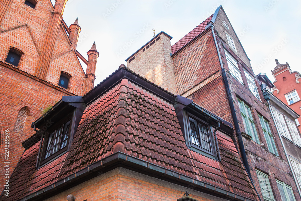 brick walls and tiled roofs of ancient buildings