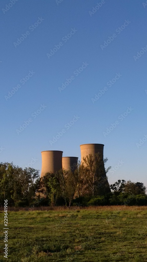 cooling towers of power station with blue sky cooling towers of power station with blue sky