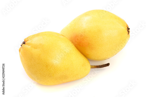 two ripe yellow pear fruits isolated on white background.