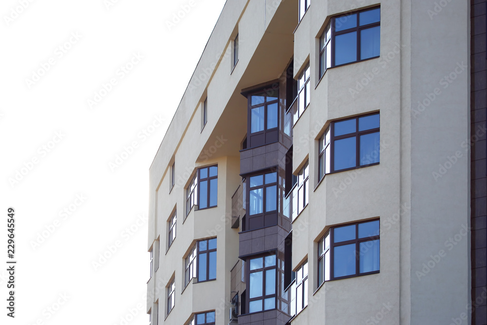 facade of apartment building against the sky facade of apartment building against the sky
