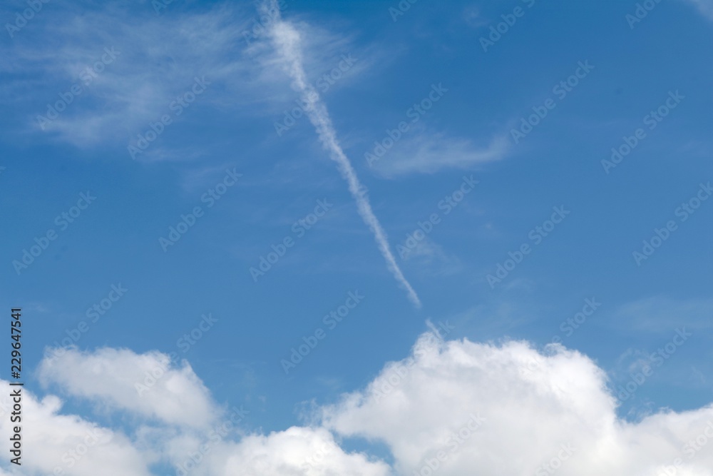 Fading jet trail in the clouds Fading jet trail in the clouds