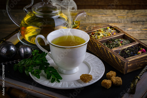 Tea in a cup on an old background