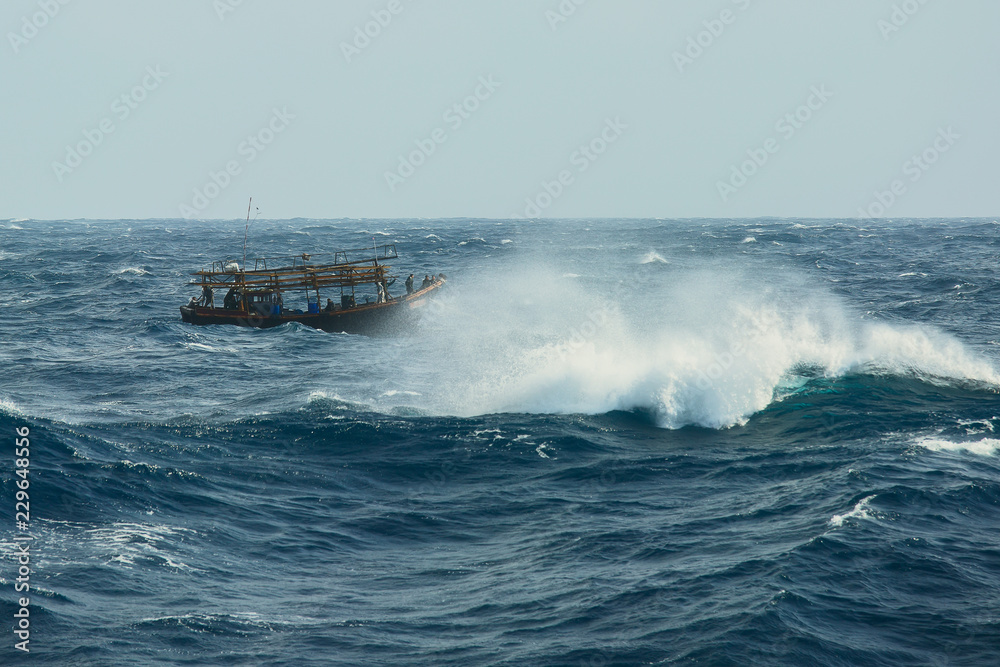 Naklejka premium North Korean fishermen in the stormy sea