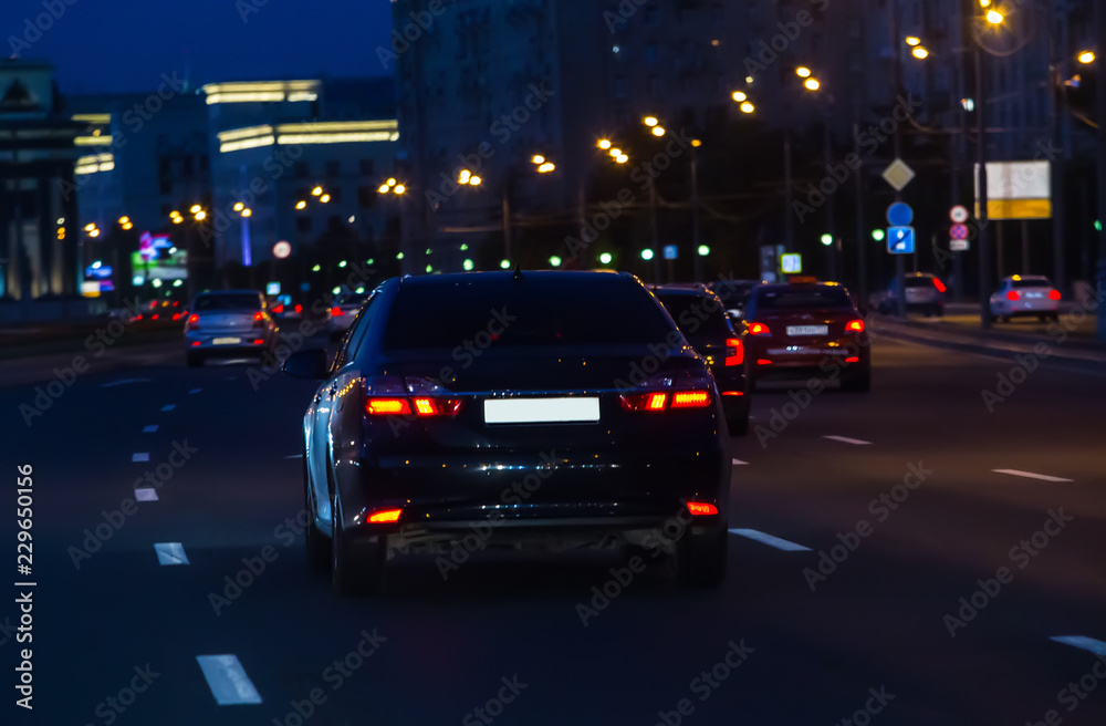 Car traffic at night on the avenue