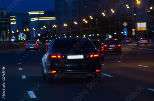 Car traffic at night on the avenue © Yuri Bizgaimer