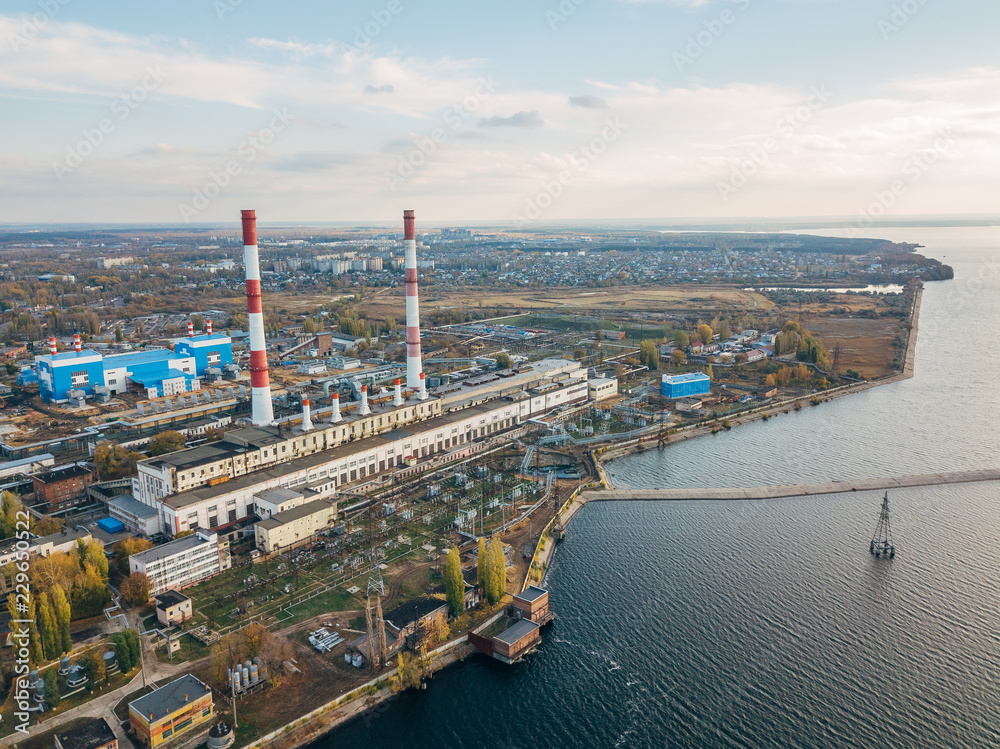 Obraz premium Thermal power plant. Aerial view from drone of large industrial area on shore of Voronezh water reservoir