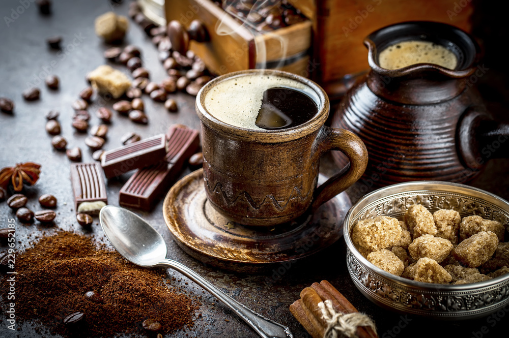 Black coffee in a composition with kitchen accessories Black coffee in a composition with kitchen accessories