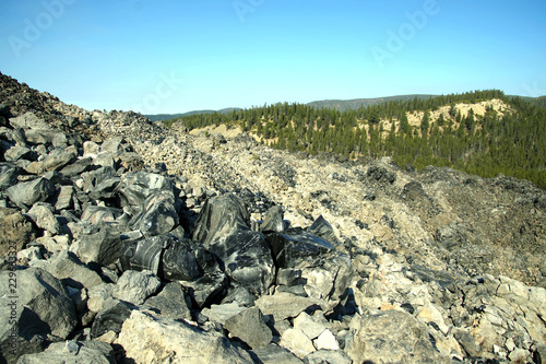 Large chunks of black obsidian glass exposed photo