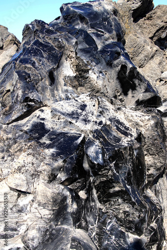 Large chunks of black obsidian glass exposed photo