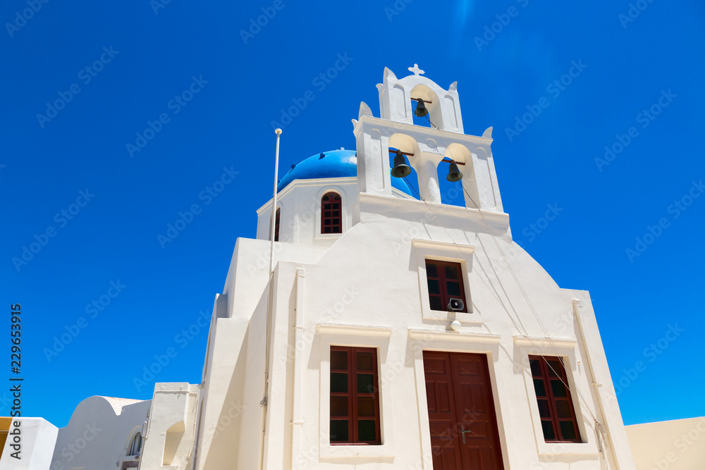 Dome of the Orthodox Church close up in town Oia. The island Santorini in Creece