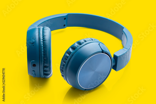 bluetooth blue headphone on yellow