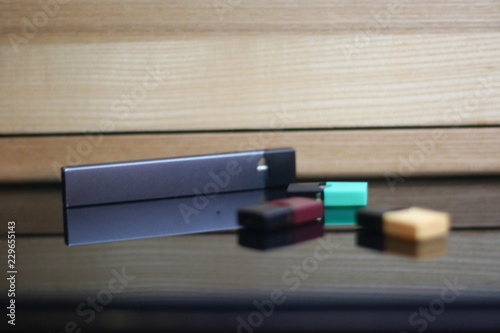 E-Cigerette on Wood background