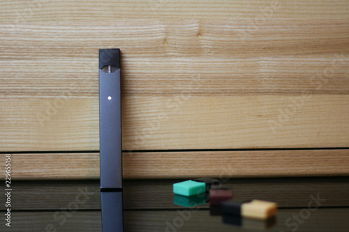 E-Cigerette on Wood background