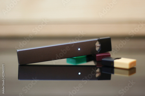 E-Cigerette on Wood background