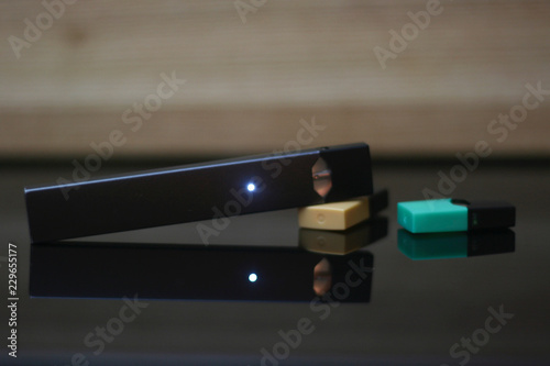 E-Cigerette on Wood background