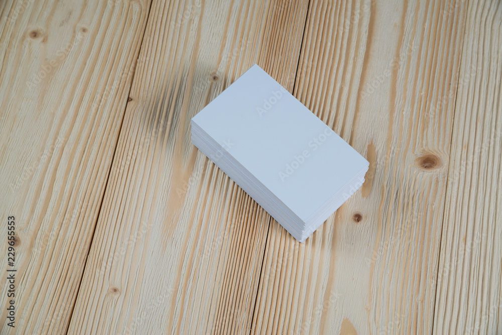 Blank business cards on wooden working table with copy space for add text ID. and logo, business company concept. Blank business cards on wooden working table with copy space for add text ID. and logo, business company concept.