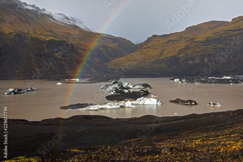 Rainbow at Solheimajokull Glacier in Iceland photo