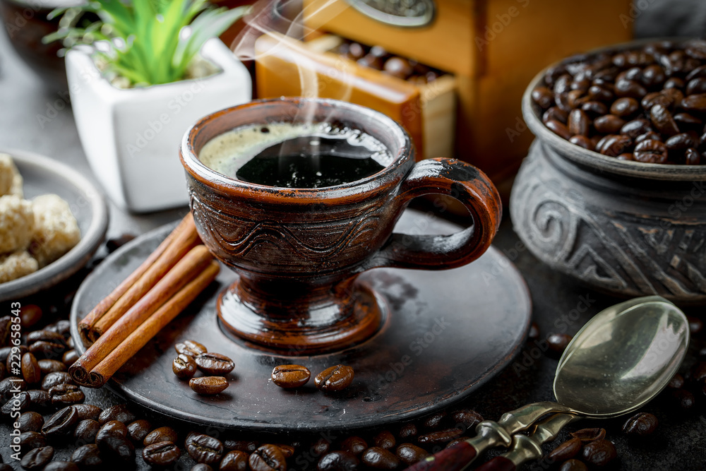 Black coffee in a cup on old background Black coffee in a cup on old background
