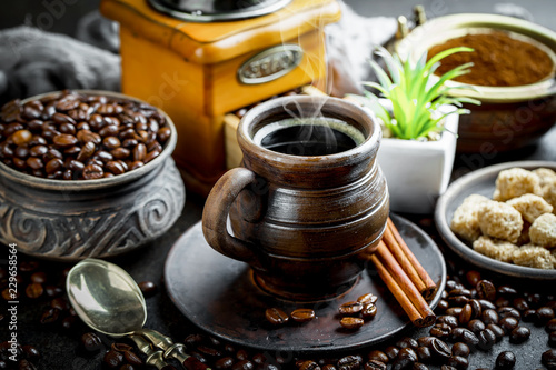 Black coffee in a composition with kitchen accessories