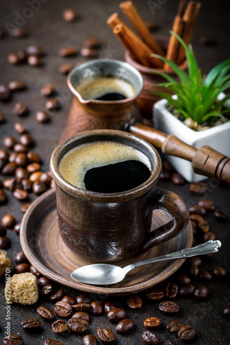 Black coffee in a composition with kitchen accessories