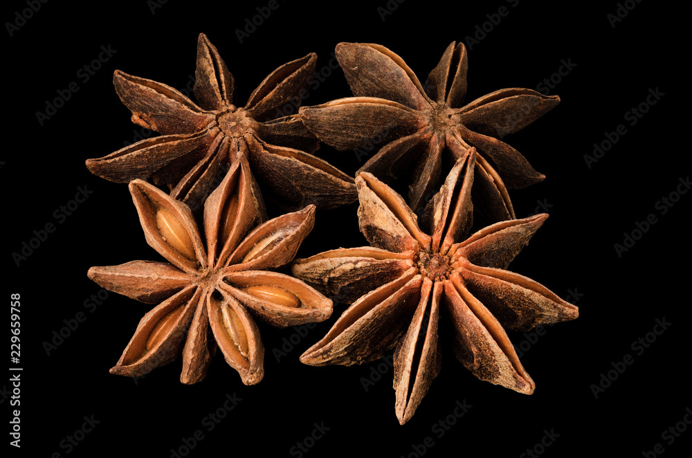 Star anise spice fruits and seeds isolated on black background Star anise spice fruits and seeds isolated on black background