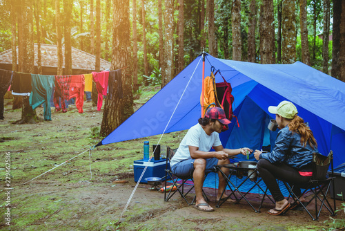 Lover asian man and asian women travel nature travel relax in the holiday. camping on the Mountain. at national park Doi inthanon Chiangmai. in Thailand