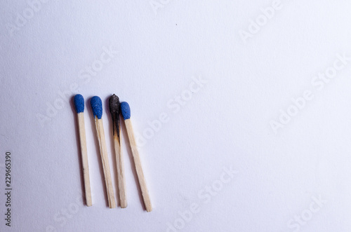 group of 4 matches and a burnt match