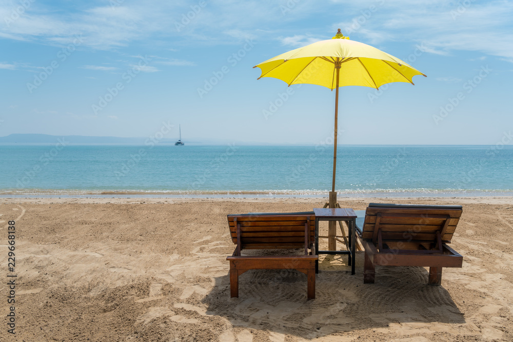 Beach Chairs and Umbrella on summer island in Phuket, Thailand. Summer, Travel, Vacation and Holiday concept.